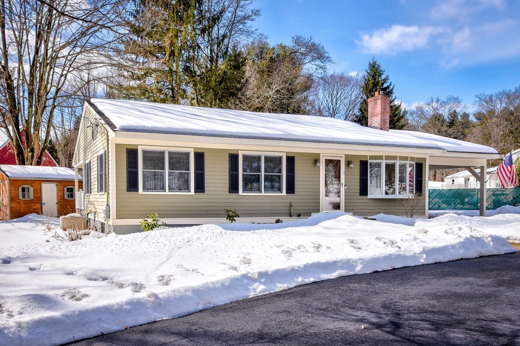 2 Gilmore Road Southborough, MA 01772 - Photo 1 of 33 a front view of a house with a yard covered in snow