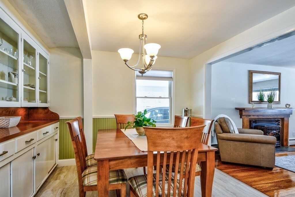 2 Gilmore Road Southborough, MA 01772 - Photo 16 of 33 a view of a dining room with furniture and a chandelier
