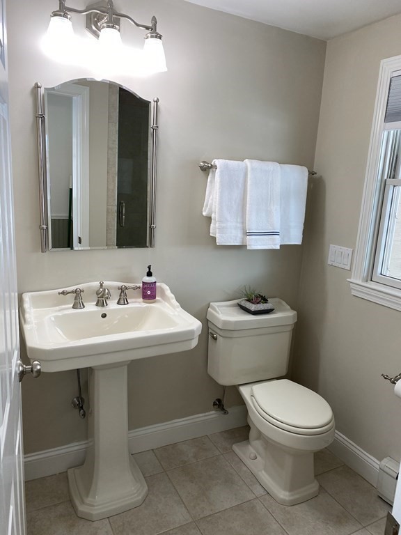 2 Gilmore Road Southborough, MA 01772 - Photo 21 of 33 a bathroom with a toilet sink and mirror