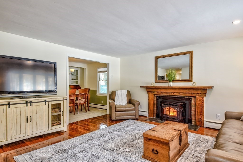 2 Gilmore Road Southborough, MA 01772 - Photo 7 of 33 a living room with furniture and a fireplace