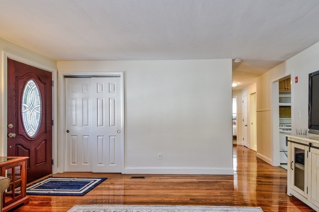 2 Gilmore Road Southborough, MA 01772 - Photo 9 of 33 a view of a livingroom with furniture and a fireplace