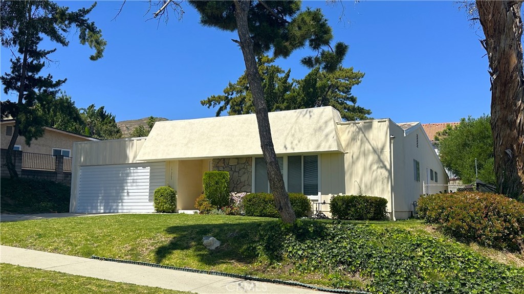 17265 Bronte Place Granada Hills, CA 91344 - Photo 1 of 1 a view of a house with a yard