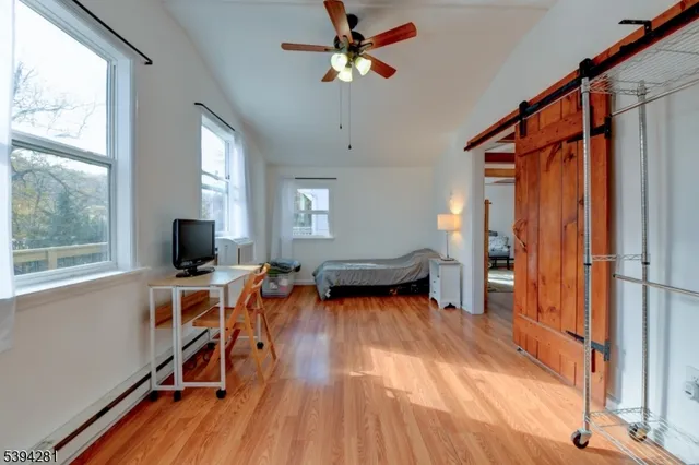 a view of a livingroom with furniture and a window