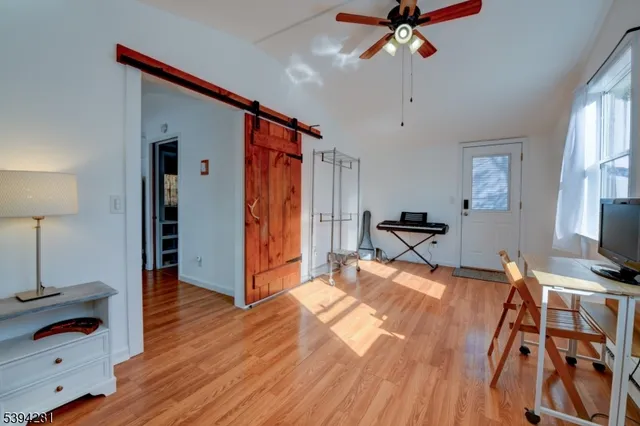 a bed room with a bed and a chandelier