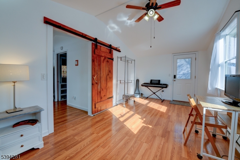 9 Woods Road Branchville, NJ 07826 - Photo 12 of 21 a bed room with a bed and a chandelier