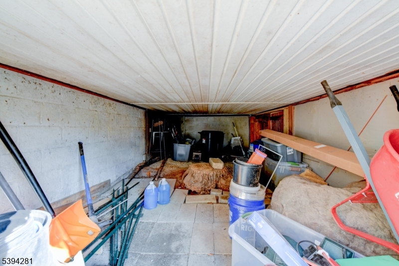 9 Woods Road Branchville, NJ 07826 - Photo 19 of 21 a living room with furniture and a chandelier