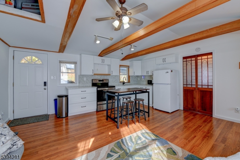 9 Woods Road Branchville, NJ 07826 - Photo 5 of 21 a view of kitchen with cabinets and wooden floor