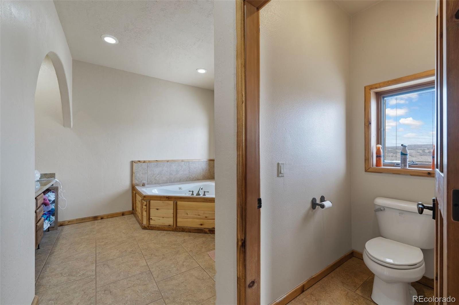 988 P Street Penrose, CO 81240 - Photo 13 of 48 a bathroom with a toilet