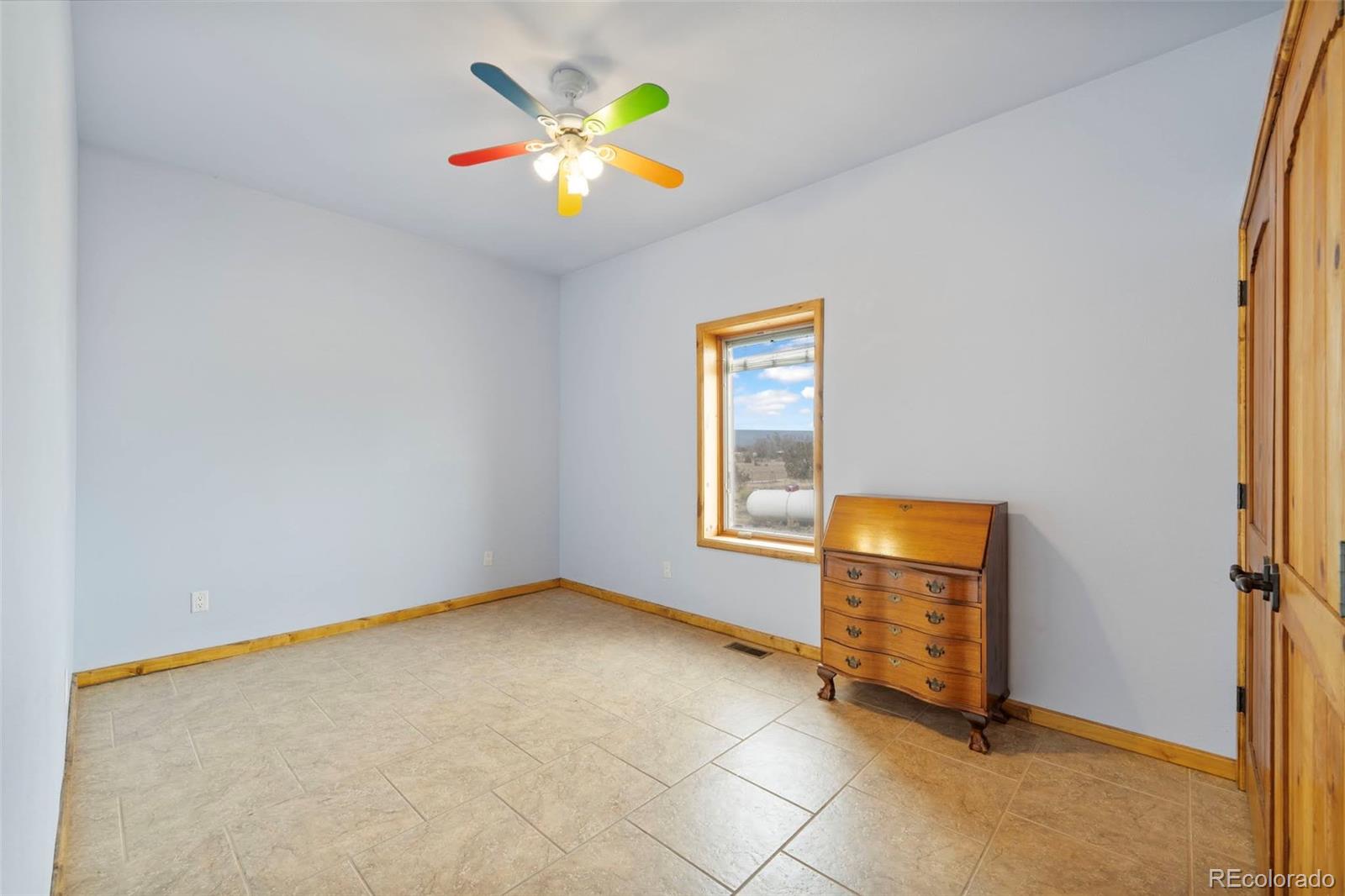 988 P Street Penrose, CO 81240 - Photo 21 of 48 an empty room with windows