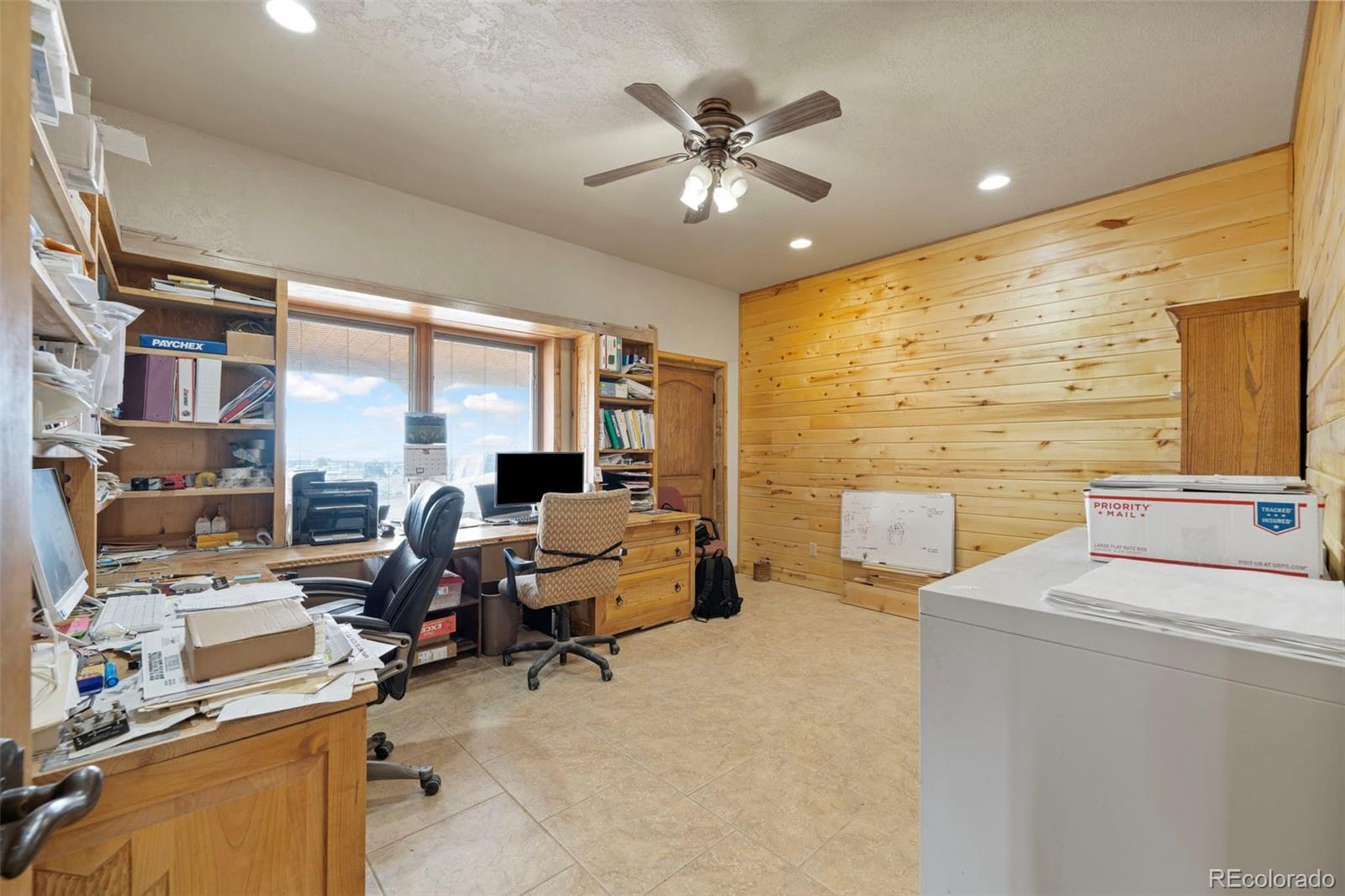 988 P Street Penrose, CO 81240 - Photo 22 of 48 a view of a livingroom with workspace and a window