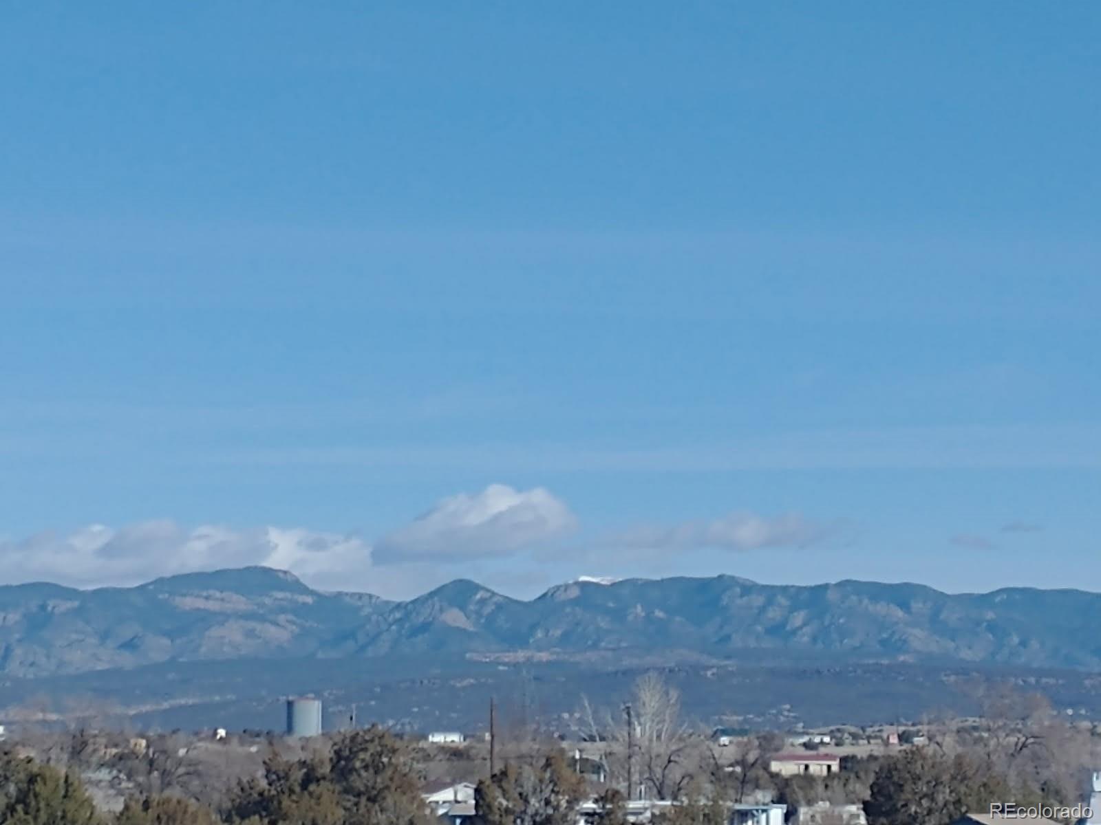 988 P Street Penrose, CO 81240 - Photo 30 of 48 a view of a town with mountains in the background