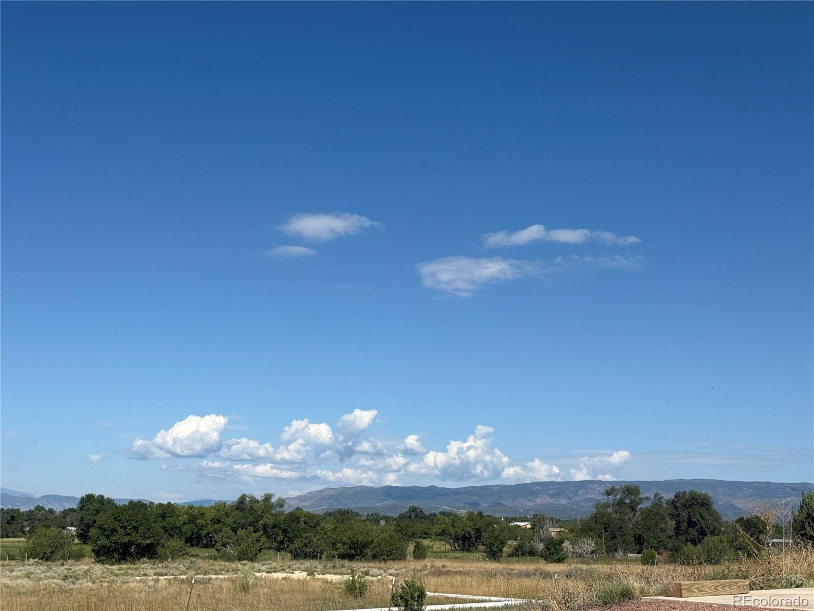 988 P Street Penrose, CO 81240 - Photo 48 of 48 a view of a lake and sunset