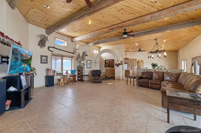 a view of livingroom with furniture and chandelier fan