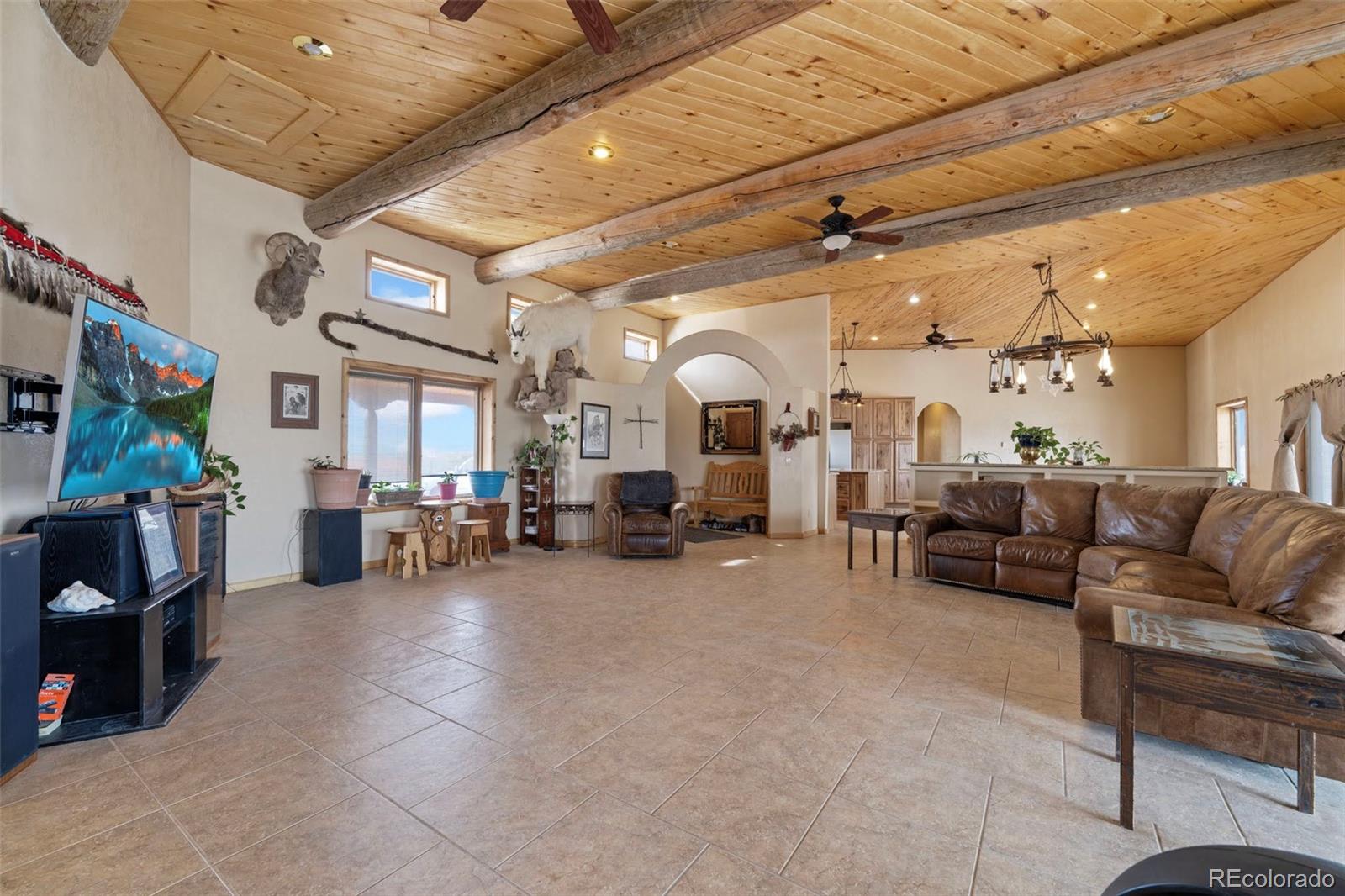 988 P Street Penrose, CO 81240 - Photo 8 of 48 a living room with furniture and a large window