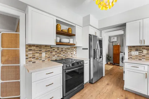 a kitchen with a refrigerator stove and sink