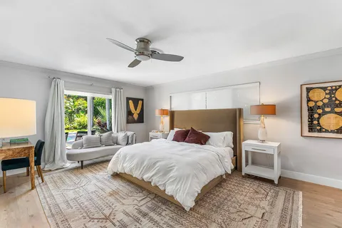 a bedroom with a large bed and a couch