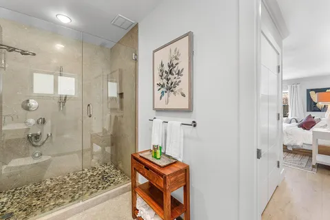 a porch with a table and chairs