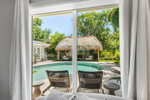 a bedroom with two beds and a window