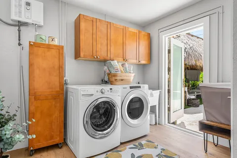 a view of a house with a swimming pool and a patio