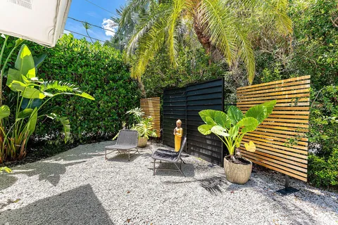 an aerial view of a house with a yard and trees