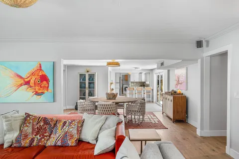 a living room with furniture and large window