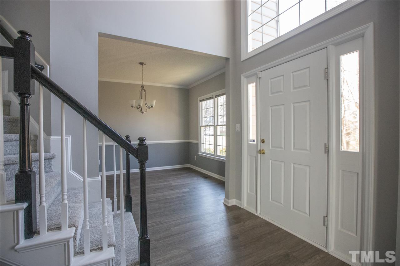 5212 Halcott Court Raleigh, NC 27613 - Photo 3 of 27 a view of entryway with wooden floor and stairs