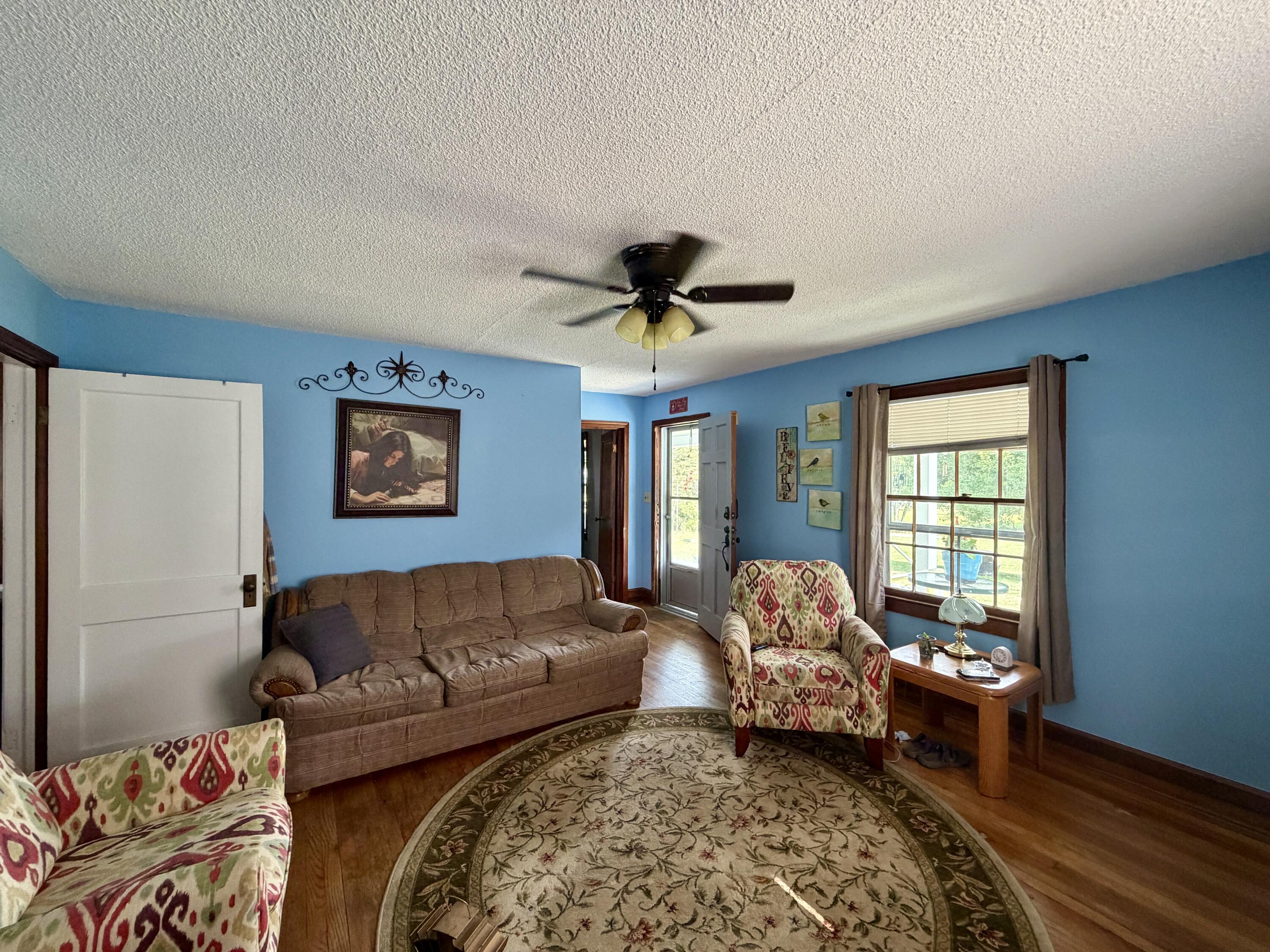 1491 Jones Ridge Road Axton, VA 24054 - Photo 3 of 17 a living room with a couch and a window