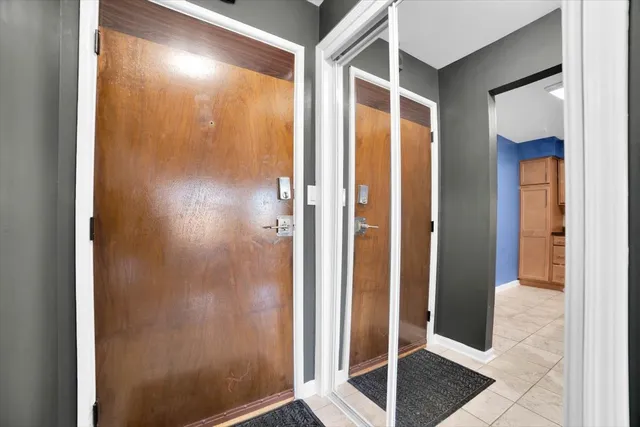 a bathroom with a shower and a glass door