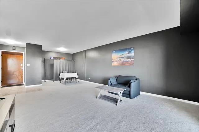 a room with furniture and air hockey table