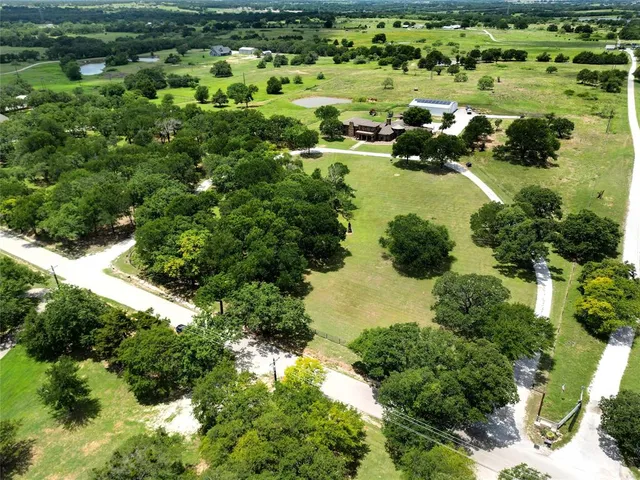 a view of a lake with a yard