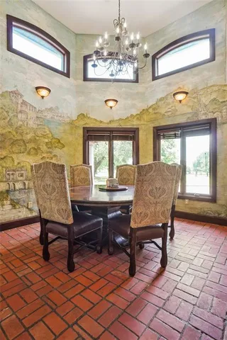 a view of a livingroom with furniture and a window
