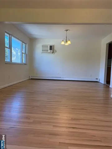 a view of a livingroom with wooden floor