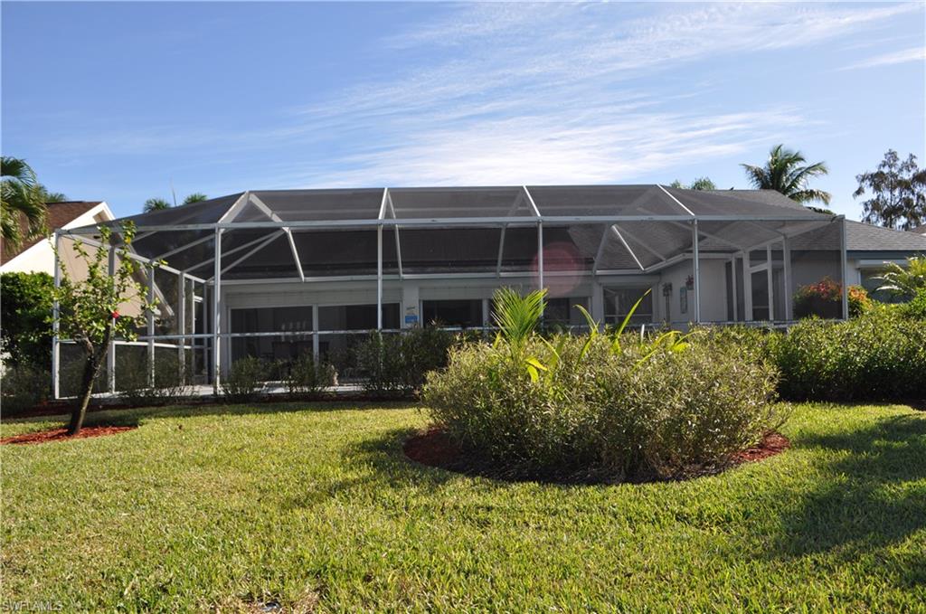 431 Dundee Court Naples, FL 34104 - Photo 18 of 20 a front view of a house with a yard