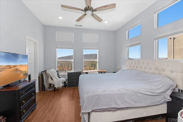 a bedroom with a bed and a desk