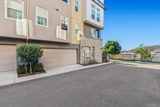 a view of a swimming pool with a lawn chairs under an umbrella