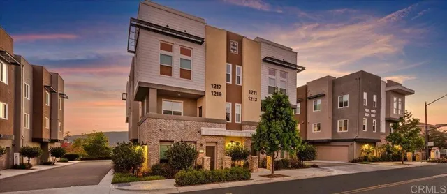 a view of a lake with a house in the background