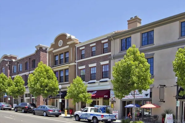 a front view of a building with garden