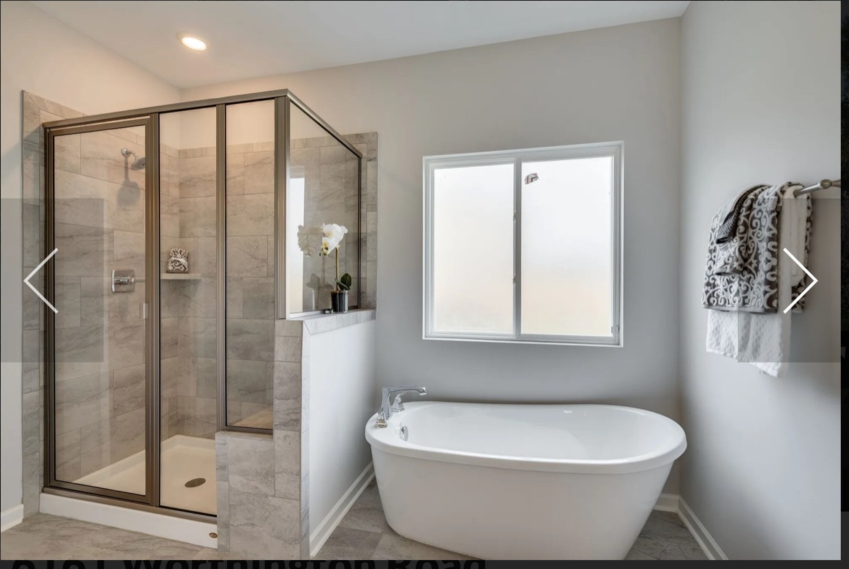 6161 Worthington Road Columbia, TN 38401 - Photo 22 of 33 a bathroom with a white tub shower and sink