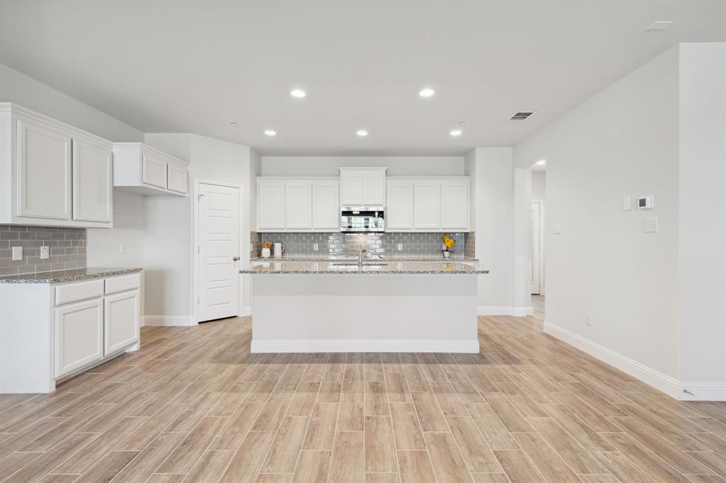 6028 Bursey Road Watauga, TX 76148 - Photo 2 of 27 a view of kitchen with wooden floor
