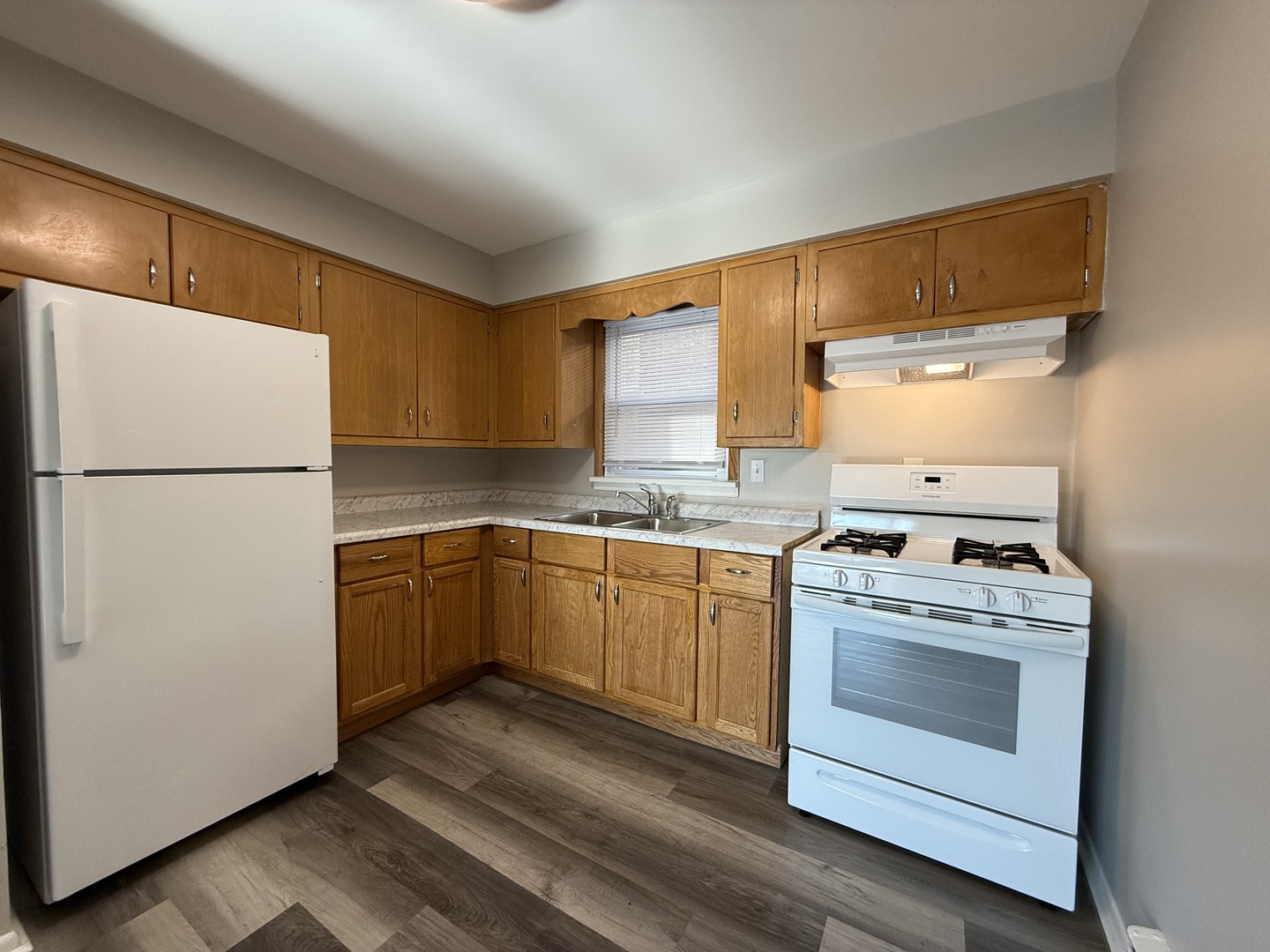 17909 Torrence Avenue, Unit 3 Lansing, IL 60438 - Photo 3 of 9 a kitchen with a stove top oven sink and refrigerator