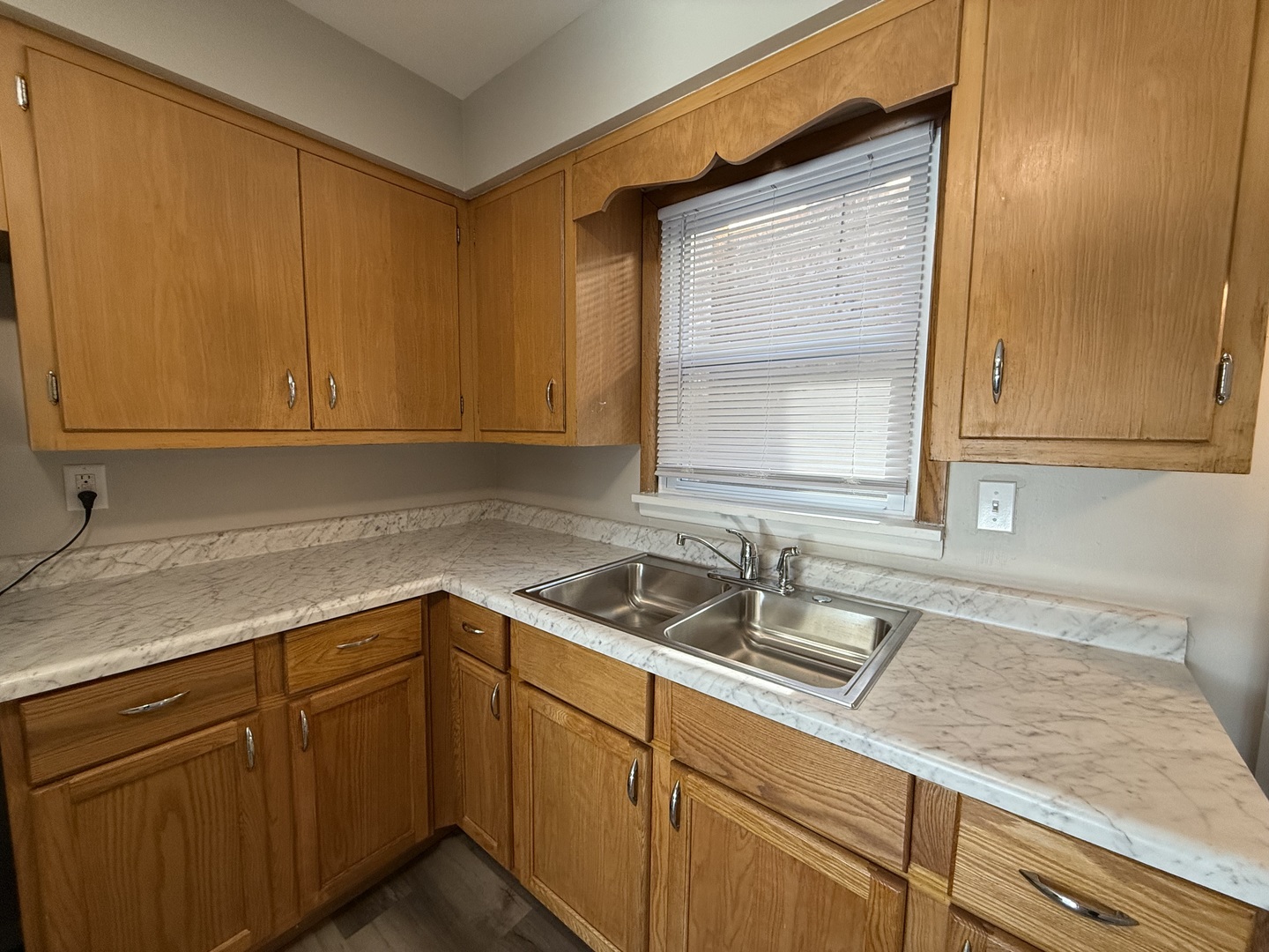17909 Torrence Avenue, Unit 3 Lansing, IL 60438 - Photo 4 of 9 a kitchen with sink cabinets and window