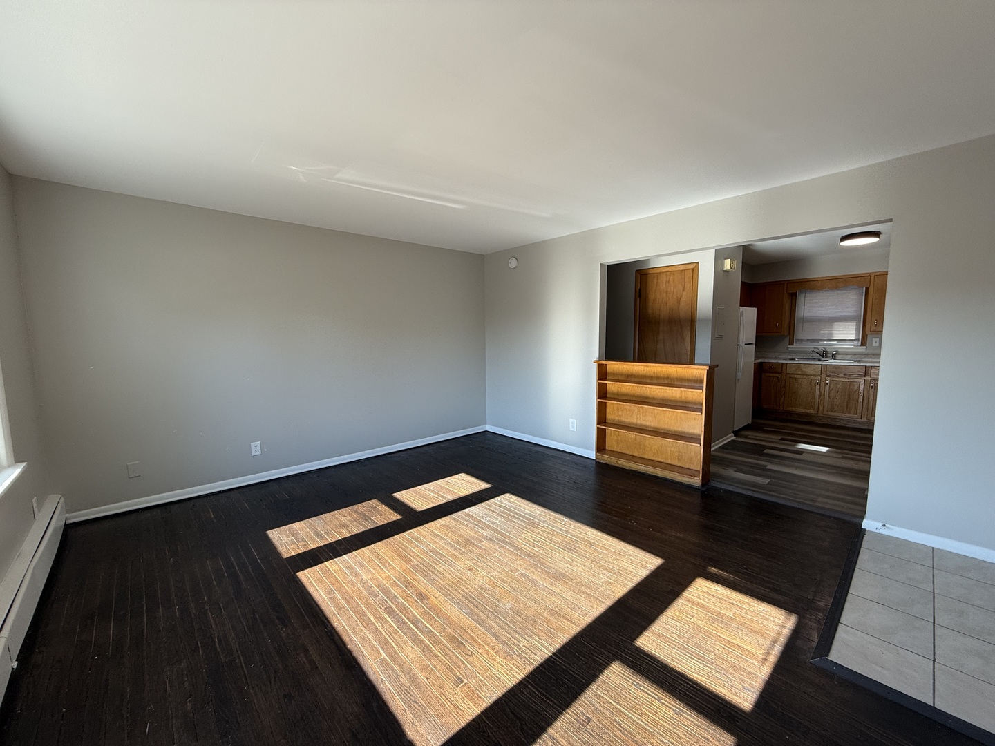 17909 Torrence Avenue, Unit 3 Lansing, IL 60438 - Photo 5 of 9 a view of an empty room and wooden floor
