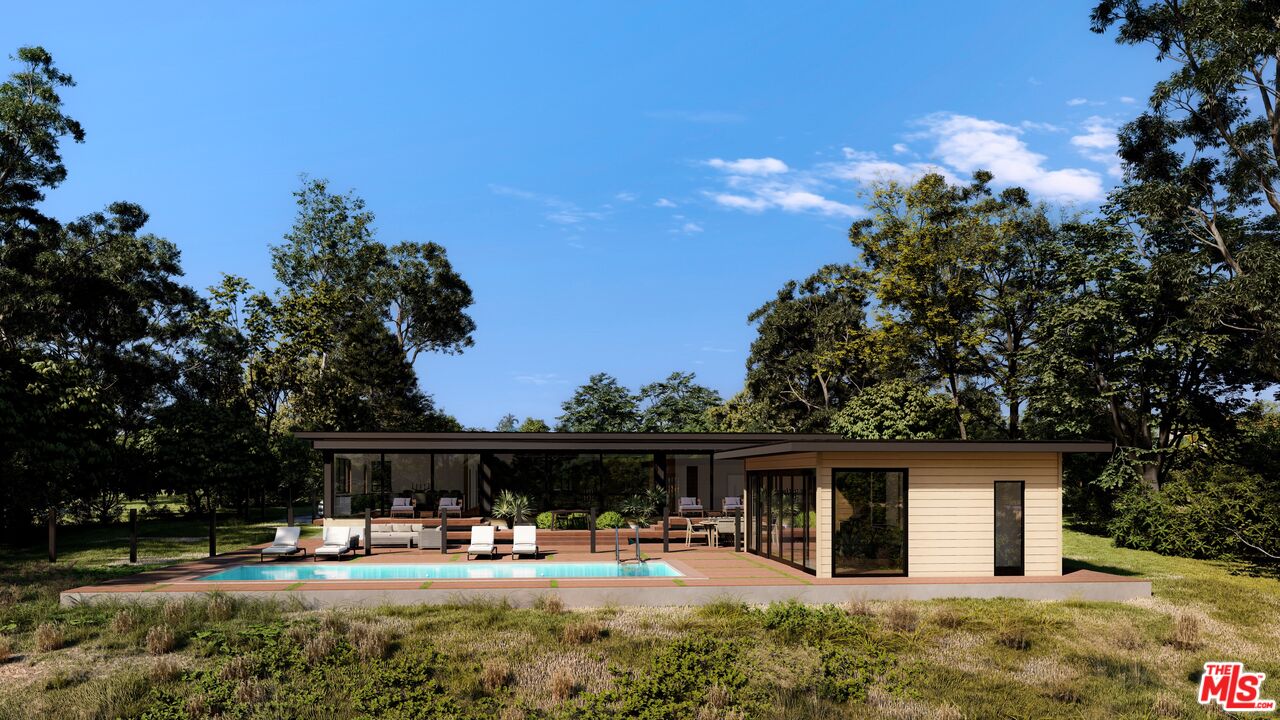 6672 Zumirez Drive Malibu, CA 90265 - Photo 1 of 32 a backyard of a house with table and chairs