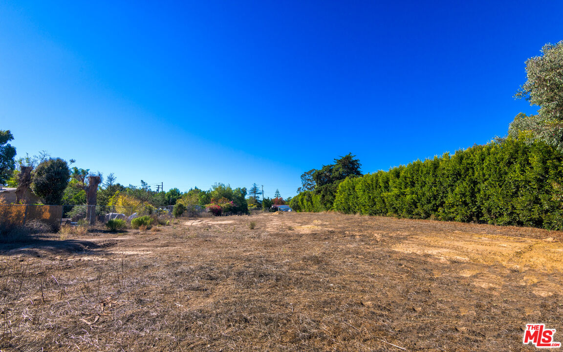 6672 Zumirez Drive Malibu, CA 90265 - Photo 18 of 32 a view of a road with a building in the background