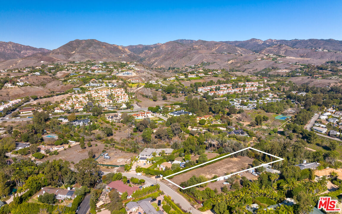 6672 Zumirez Drive Malibu, CA 90265 - Photo 25 of 32 a view of a city with mountains in the background