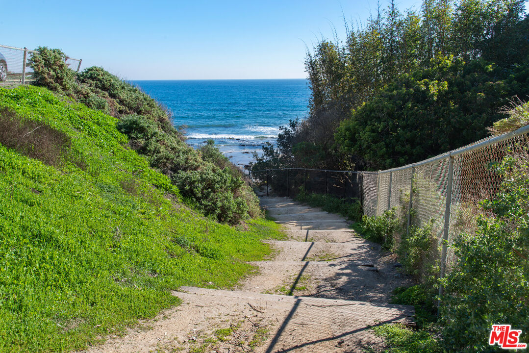 6672 Zumirez Drive Malibu, CA 90265 - Photo 27 of 32 a view of a garden with an ocean view