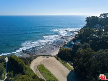a view of a lake with mountains in the background