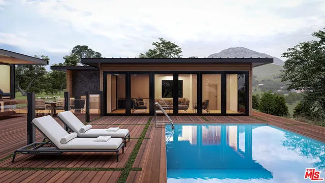 a view of a patio with couches and dining table with wooden floor