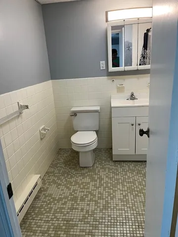 a bathroom with a sink a toilet and bathtub