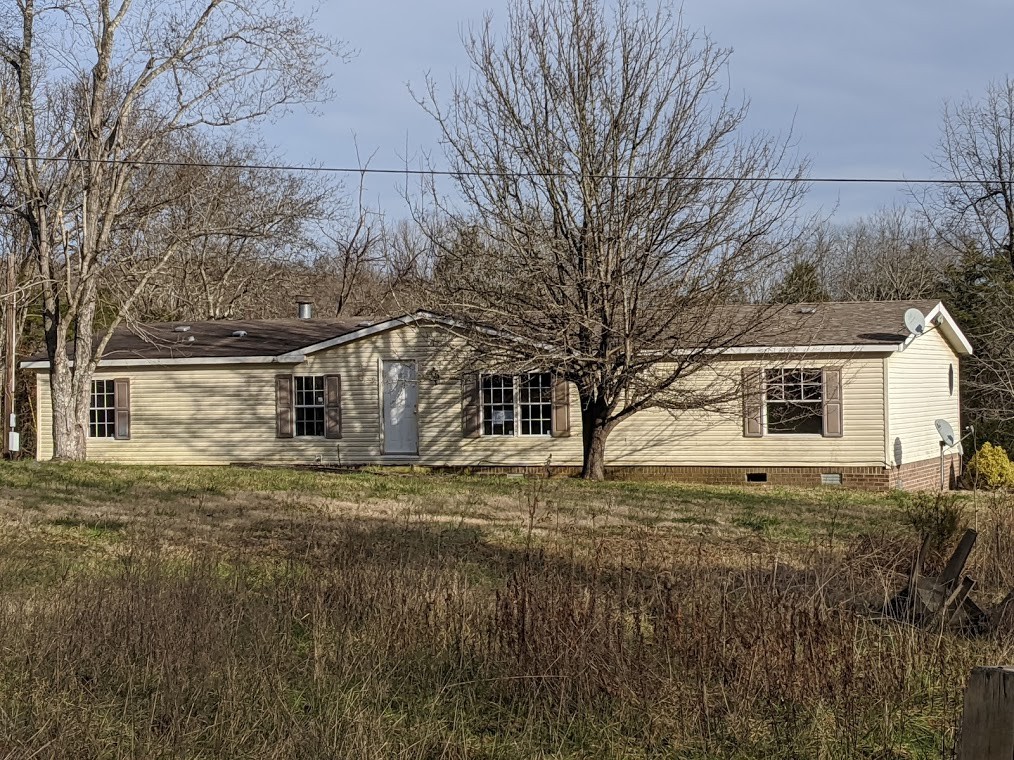915 Burford Road Lebanon, TN 37087 - Photo 1 of 10 a view of a yard in front of a house with large trees